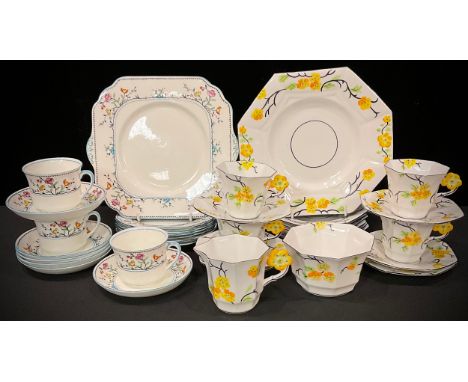 An Art Deco Melba China part tea service, yellow flower handles, comprising cream jug, sugar bowl, cake plate, side plates, c