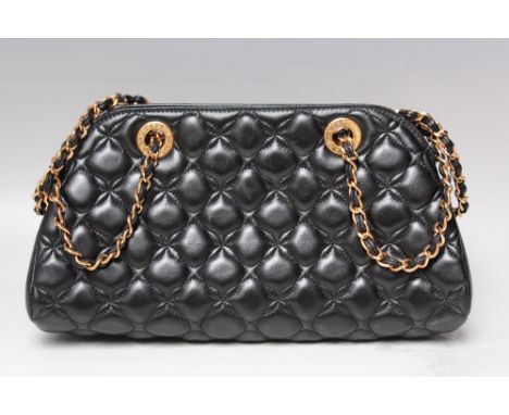 A CHOPARD BLACK QUILTED EVENING BAG, with gold-tone chain and hardware open topped with zipped pockets to the interior, H 17 