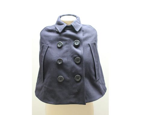 A BURBERRY CHILDS NAVY CAPE, with typical check lining, size medium 