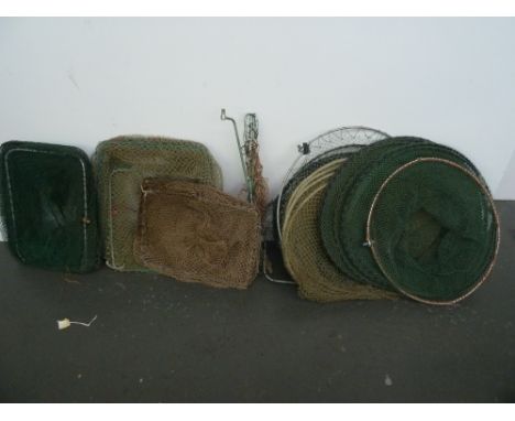 A selection of vintage coarse fishing tackle to include 5 keep nets, two green umbrellas, bank sticks, canvas rod bag, two pl