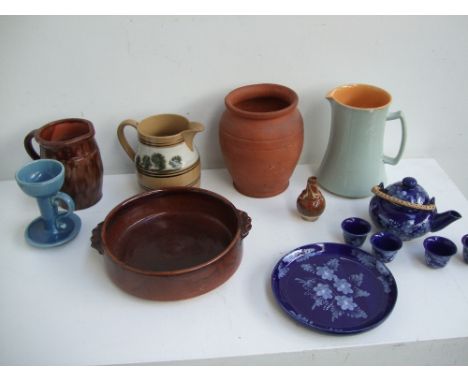A qauntity of stoneware to include a light green glaze jug, a Pembury ware jug and blue glaze floral egg cups (14)