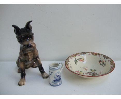 A quantity of ceramics to include a Goebel terrier figurine, a Delft miniature tankard decorated with typical blue and white 