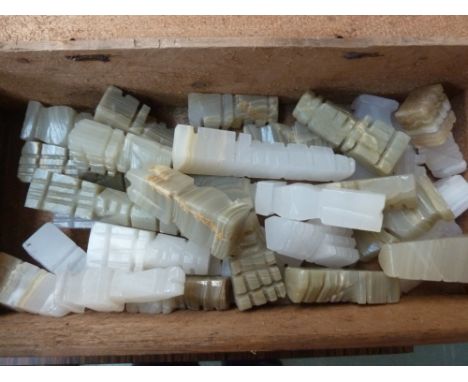 A box of soapstone chess pieces
