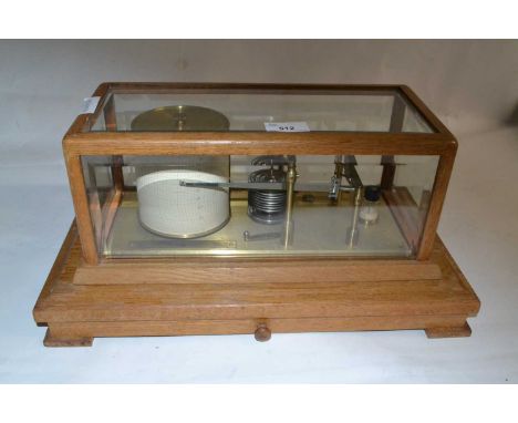 Negretti &amp; Zambra, London, a light oak cased barograph of typical form, 42cm wide max