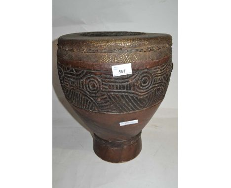 Ethnographica/tribal interest - An unusual carved wooden drum, the top covered with snake or reptile skin, 30cm diameter, 39c