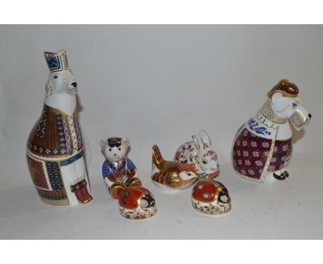 A Royal Crown Derby group of paperweights including gold stopper, model of a bear, silver stopper bird, two ladybirds, gold s