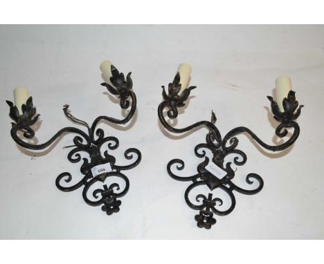 A pair of iron wall sconce light fittings, 26cm high max