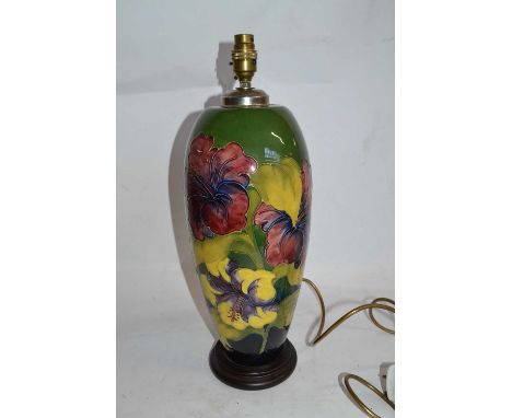 An impressive Moorcroft lamp base, the green ground decorated with Hibiscus, 40cm highGood condition - no crazing