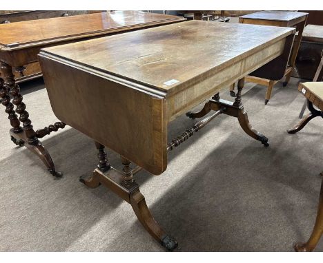 19th Century mahogany sofa table with drop leaves and two drawers with ringlet handles, 106cm wide when closed