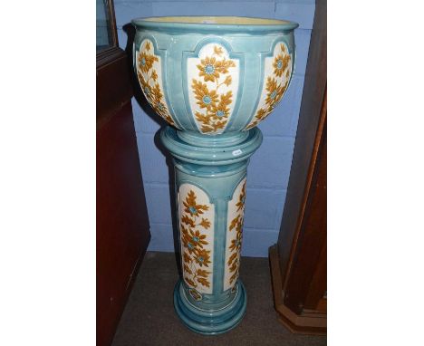A Burmantofts jardiniere and stand, both pieces with floral decoration within light blue panels and matching column, 107cm hi