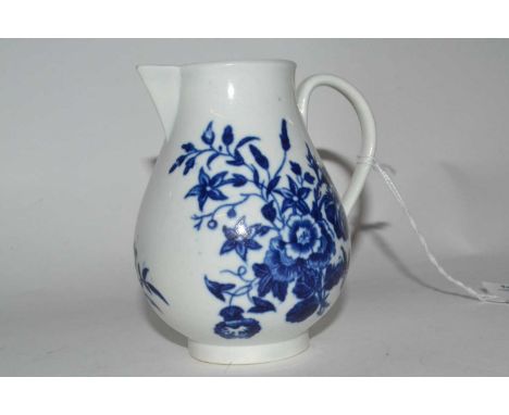 An 18th Century Worcester sparrow beak jug with an underglaze blue design, 9cm high