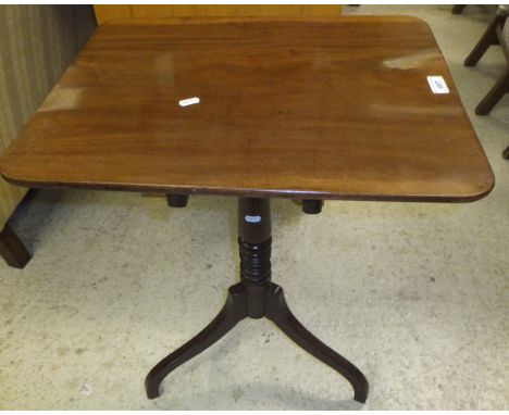 A 19th Century mahogany occasional table, the square top raised on a ringed and turned pedestal to tripod legs