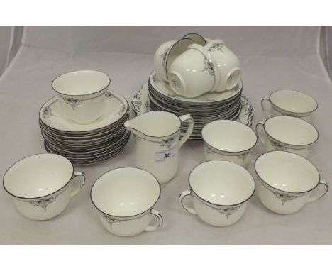 A collection of Shelley tea wares for twelve place settings to include cups and saucers, tea plates, milk jug and two cake pl