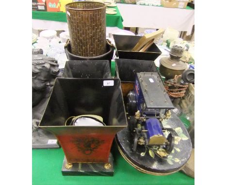A leather bucket with leather carrying handle, assorted other metal bodied waste paper bins, a model of a car, a tin hat box,