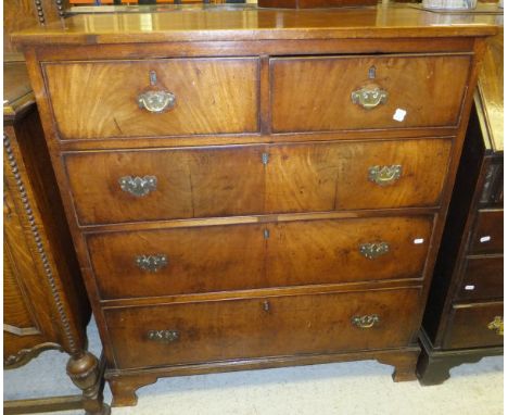 A Victorian mahogany chest of two short and three long graduated drawers on bracket feet