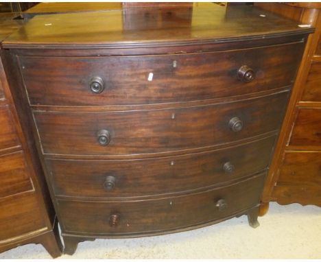 A Victorian mahogany bow fronted chest of four long graduated drawers on splayed bracket feet