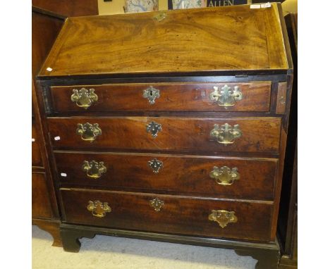 A mid 18th Century mahogany bureau, the cross-banded fall front enclosing fitted interior with pigeon holes and drawers with 