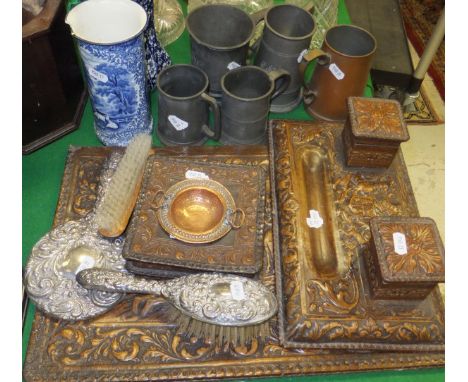 A collection of four pewter mugs, a coppered tankard, a Spanish embossed leather blotter, desk stand and inkwell, the blotter