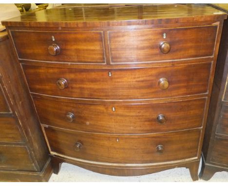 A Victorian mahogany bow fronted chest of two short and three long graduated drawers on splayed bracket feet