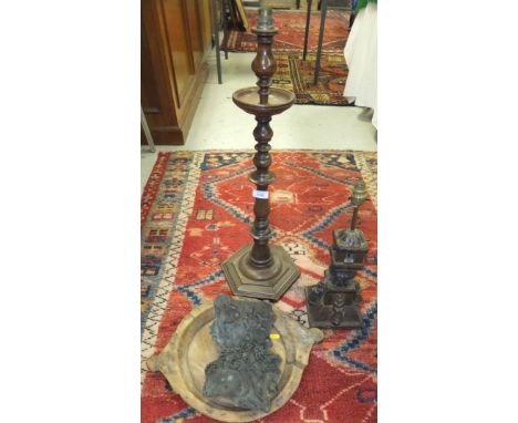 A turned wood table lamp base in the form of a pricket candlestick, an Indian painted table lamp base, two carved wood printi