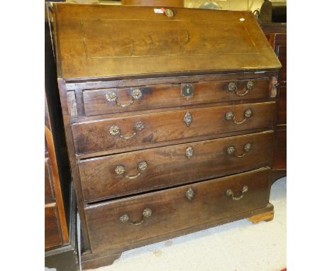 A George III mahogany bureau, the sloping fall satinwood and ebony strung enclosing a fitted interior over four long drawers 