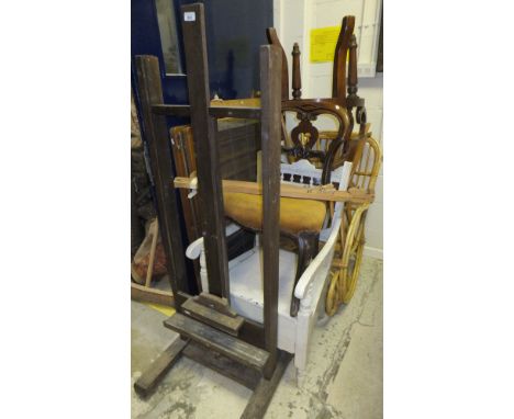 A collection of furniture comprising a studio easel, a Windsor & Newton folding easel, a Heal's cot, two Ercol stick back cha