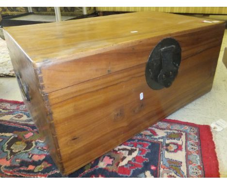 An Oriental teak trunk with large lock