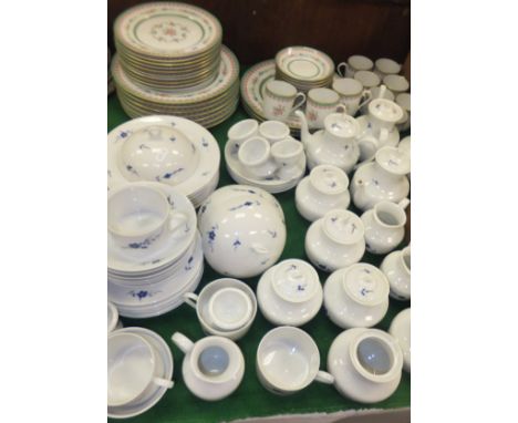 A collection of Limoges porcelain (for Chastagner & Cie) tea wares to include individual size teapots, cups and saucers, muff