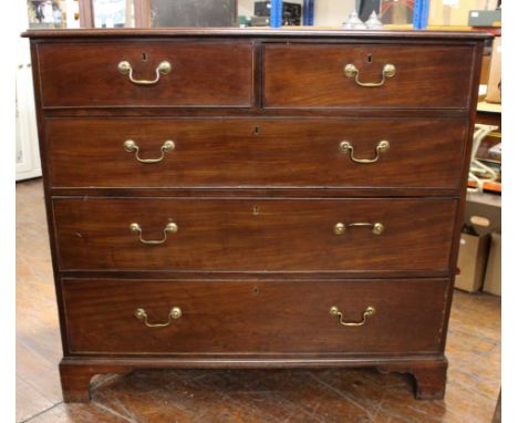 An&nbsp; early 19th century mahogany chest of three long and two short graduated drawers, brass swan neck handles, bracket fe
