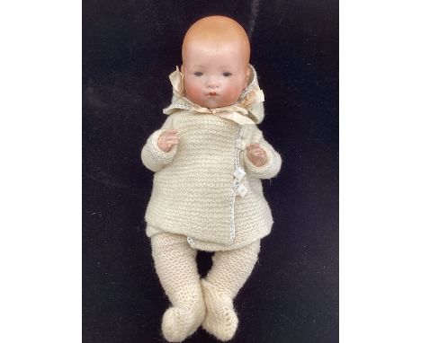 Antique 13&rdquo; German Bisque head AM Baby Dream baby doll with bisque head and composition bent limb body in Knitted pram 