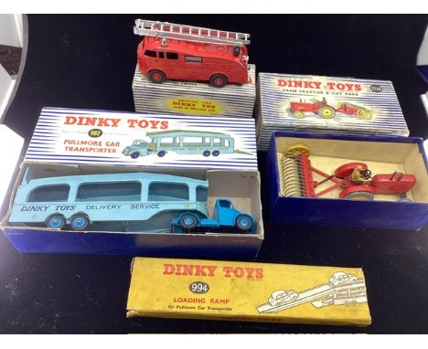   Dinky Diecast Vehicles to include a 982 transporter, and a 994 ramp, a 955 Fire engine and a 27AK tractor and Hay rake set,