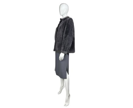 1970s fashion to include a Smokey blue grey nutria fur jacket, shorn to give a stranded effect by Fabian Furs of Mayfair. Thi