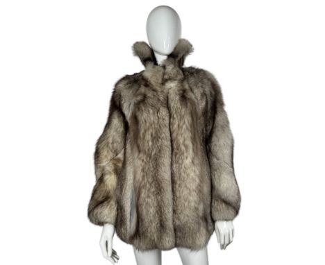 A vintage 1970S platinum fox fur jacket with spiral cut sleeves and a 'shirt' collar, silver satin lining with grey suede bet