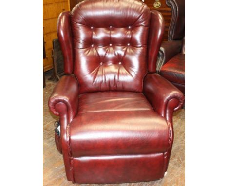 Red button back Sherborne leather electric rise and recliner.&nbsp; Fully working but damage to front bottom corner as pictur