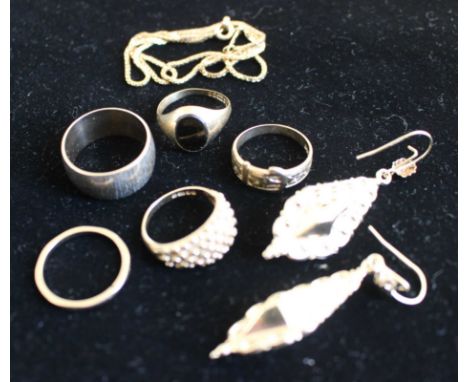 Selection of Gold jewellery to include belt ring, onyx ring, narrow band, wide band, boule bubble ring, drop earrings, chain.
