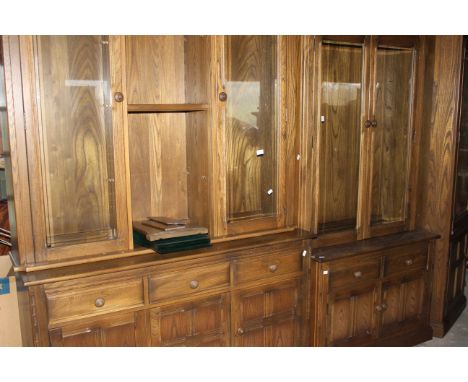 3 x bays of Ercol lounge display units in dark oak finish very good condition and to include all shelves and fittings in incl