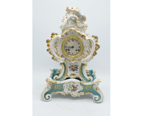 19th Century Jacob Petit porcelain hand painted mantle clock with a porcelain base with an open face showing Roman numerals. 