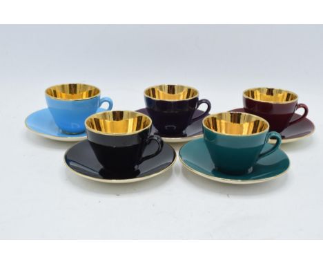 A collection of five 20th century Danish Copenhagen Confetti pattern coffee cups and saucer (duos) of various colours with gi