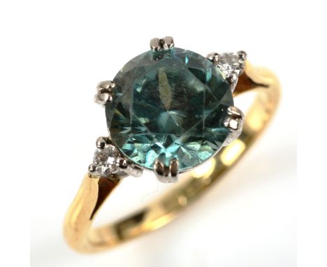 A three stone blue zircon and diamond dress ring, unmarked yellow metal settings, size M, 4gNo damage or repairs, all stones 