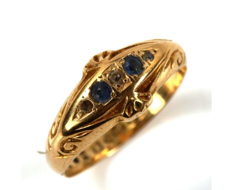 An early 20th century 18ct gold graduated five stone sapphire and diamond half hoop ring, hallmarks Chester 1910, setting hei