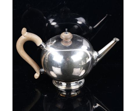 An Edward VIII silver bullet teapot, in 18th century style, with turned wood mounts, by Wakely & Wheeler, hallmarks London 19