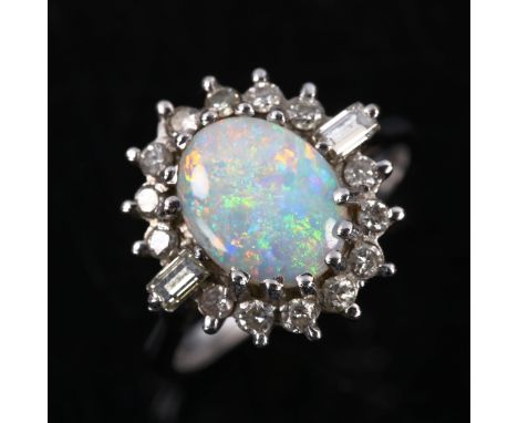 A late 20th century 18ct white gold opal and diamond cluster ring, set with oval cabochon opal and baguette and round brillia