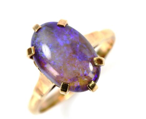 A 9ct gold opal dress ring, set with oval cabochon opal, setting height 15.5mm, size Q, 4gNo damage or repairs, settings ligh