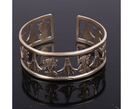 A Continental silver Aztec Revival torque bangle, band width 22.1mm, internal diameter 6cm, 30.2gNo damage or repairs, only g