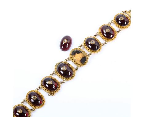 A Georgian garnet and diamond panel bracelet, unmarked yellow metal settings with oval cabochon garnet and rose-cut diamond c