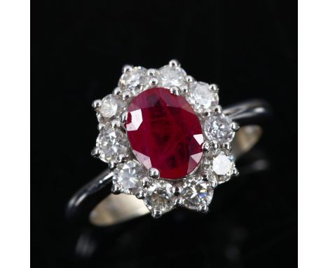 A modern 14ct white gold ruby and diamond oval cluster ring, set with oval mixed-cut ruby and modern round brilliant-cut diam