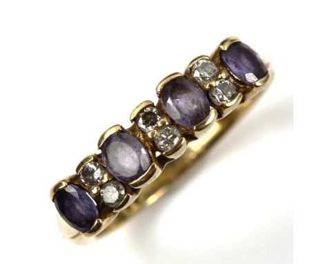 A modern 9ct gold tanzanite and diamond half hoop ring, set with oval-cut tanzanite and modern round brilliant-cut diamonds, 