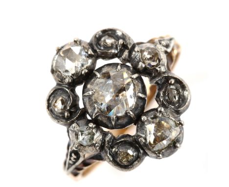 A Georgian rose-cut diamond dress ring, unmarked rose gold settings with silver tops, and Dutch rose-cut diamonds with closed