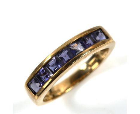 A modern 9ct gold tanzanite half eternity ring, set with square-cut tanzanite, setting height 4.7mm, size M, 3.3gNo damage or