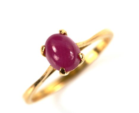 A modern 18ct gold cabochon ruby dress ring, ruby measures: 7.00mm x 5.42mm x 4.20mm, size N, 2.3gNo damage or repairs, baske